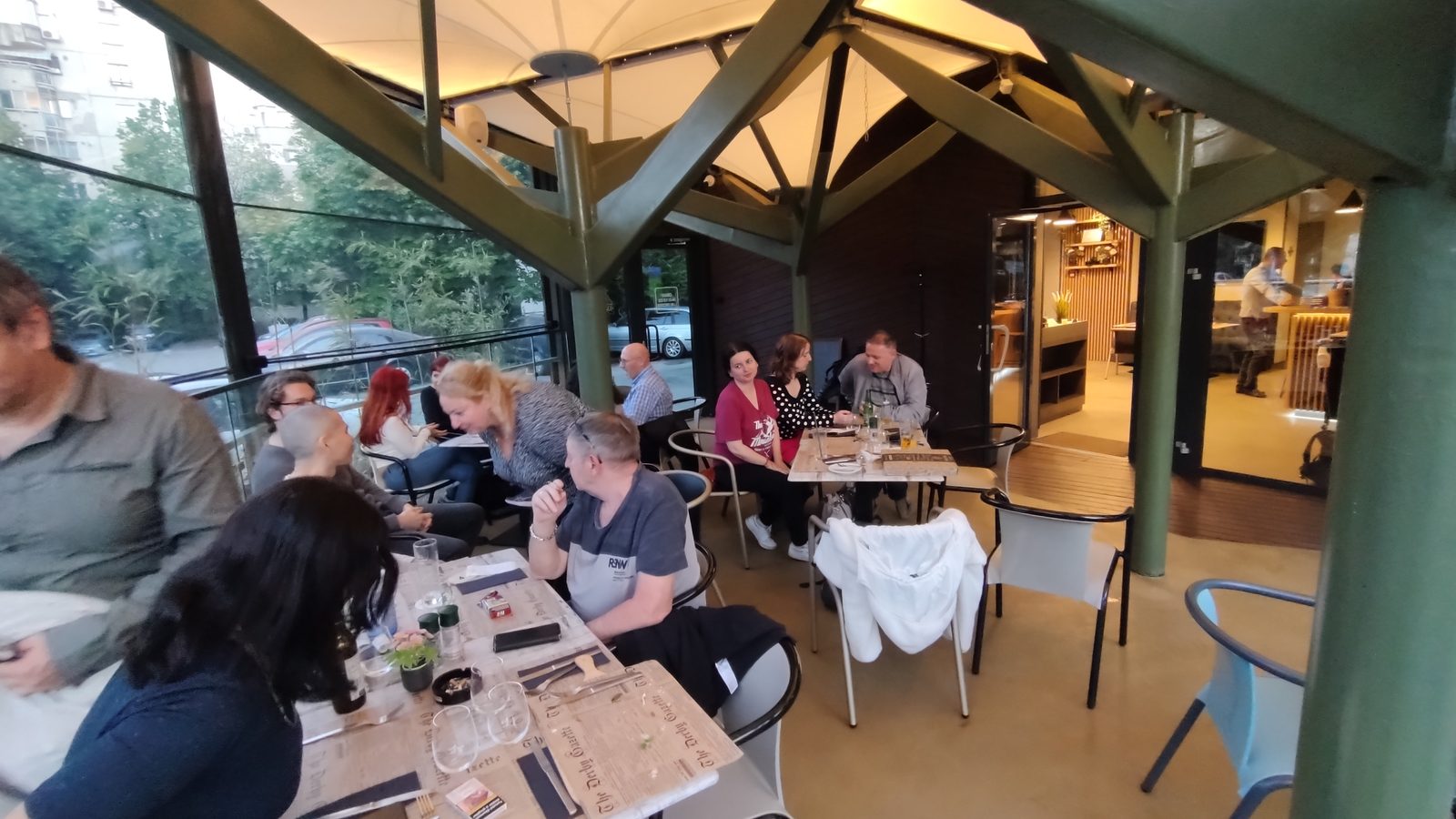 An evening of the Bucharest expat meetup, tables full of people talking